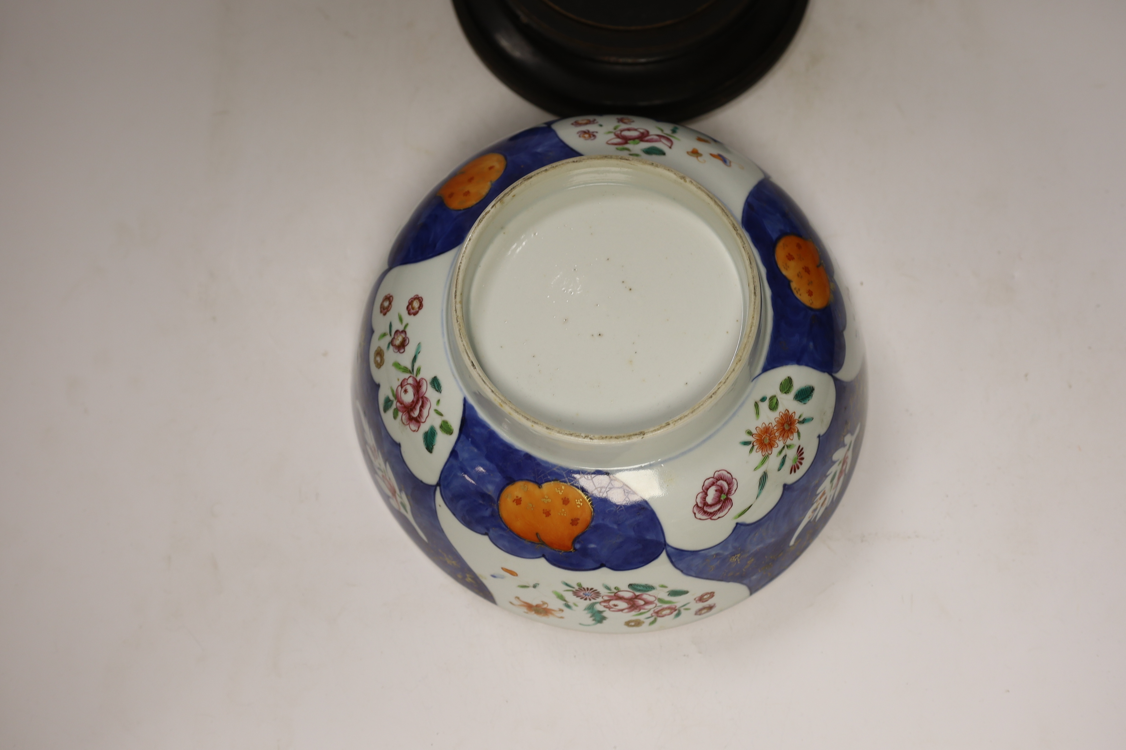 A large 18th century Chinese Export porcelain bowl, on associated stand, 28cm diameter